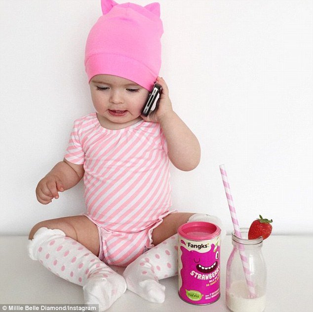 'Oh hey, I totally found this sugar free milkshake, you should try it sometime,' her mum joked Millie-Belle said as she held a phone while posing in a stripy pink outfit